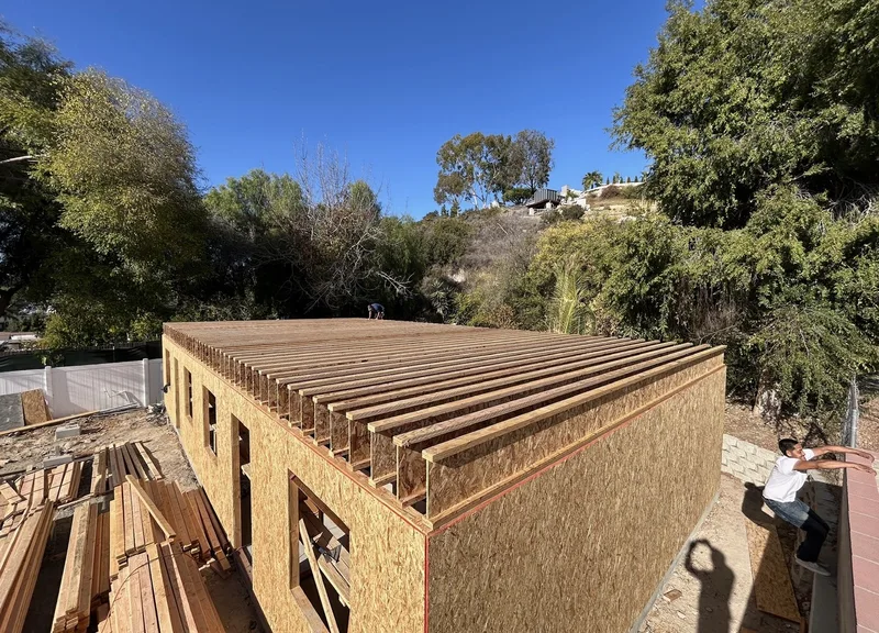 Second-floor deck and joist preparation over first-story walls