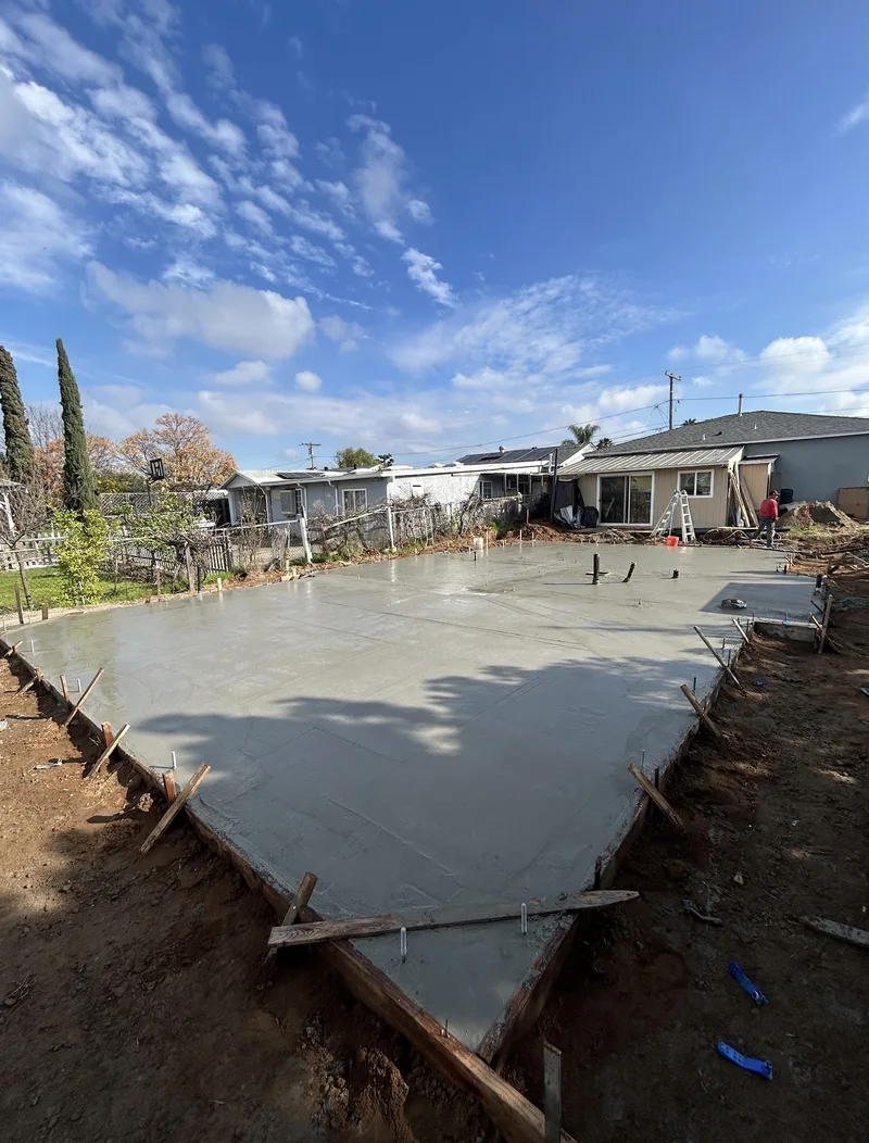 Fresh concrete slab foundation pour for new construction